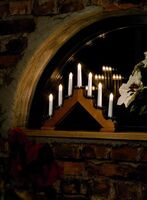 Elljusstake 7 lj trä röd